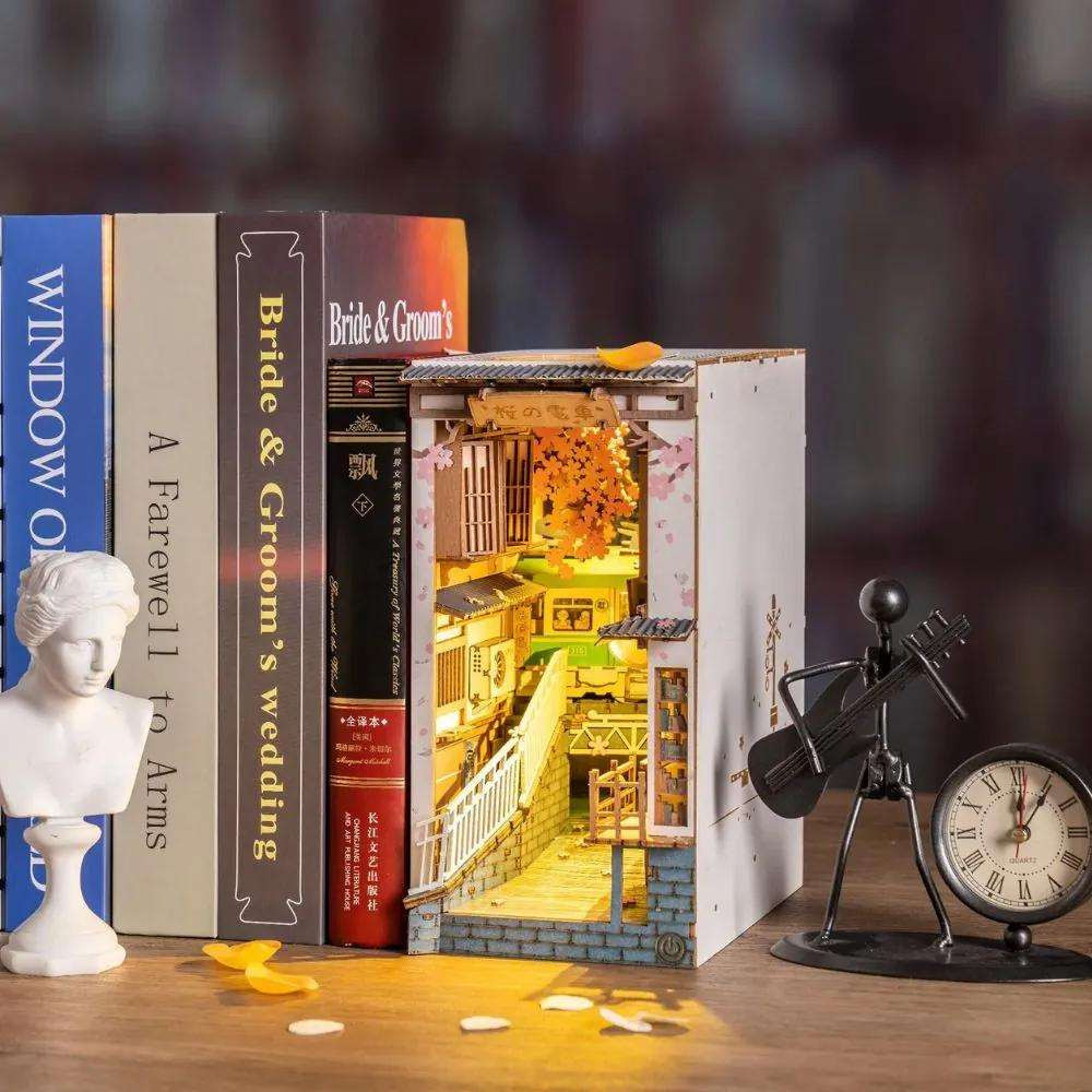 Sakura Densya Book Nook with glowing interior on a bookshelf—perfect for bookworm beginners