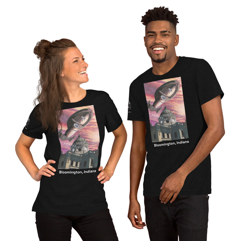 Short-Sleeve Unisex T-Shirt: J.K. Woodward Print on the front and Janeway Collective Logo on the sleeve