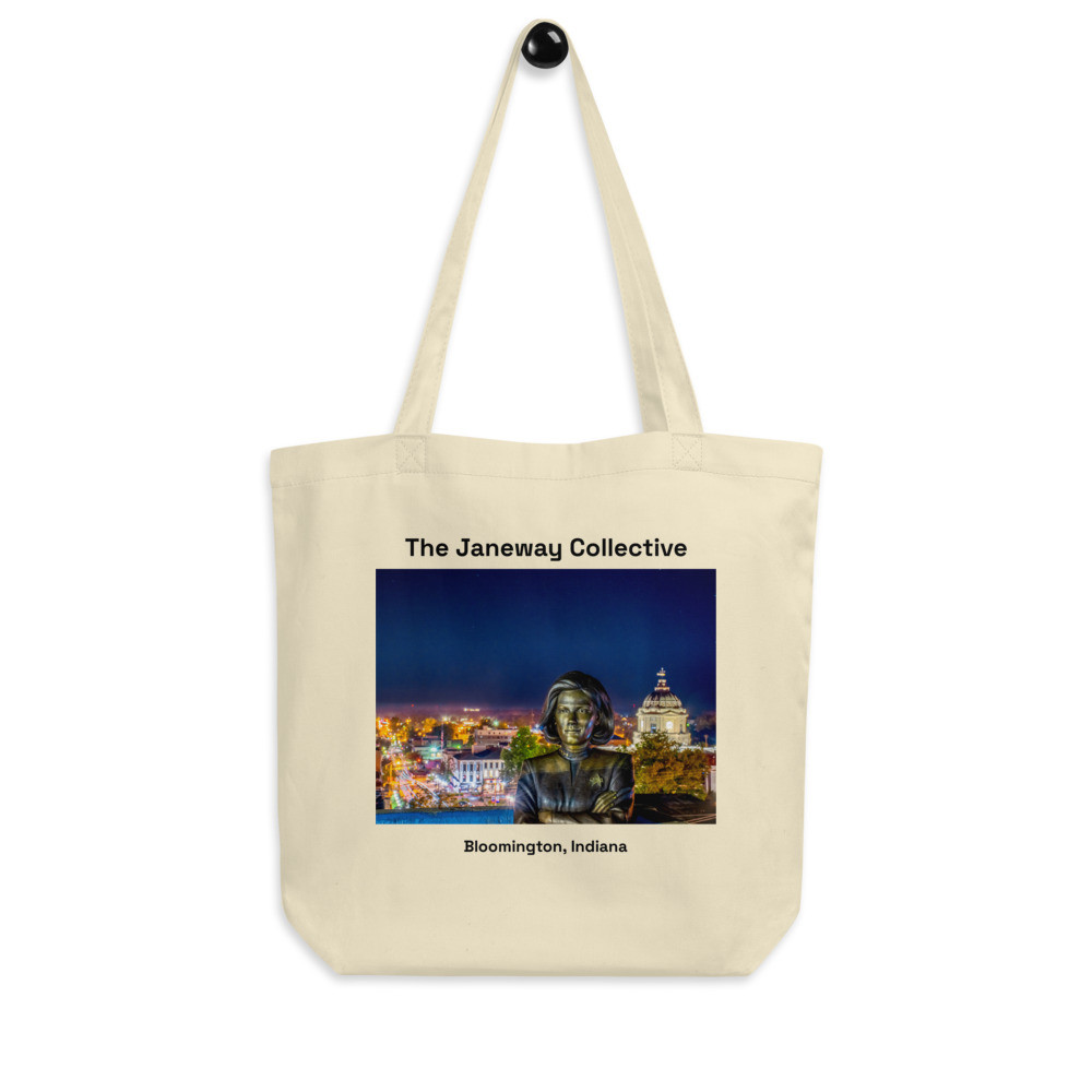 Tote Bag: The Captain Janeway Statue illuminated by downtown Bloomington, Indiana 