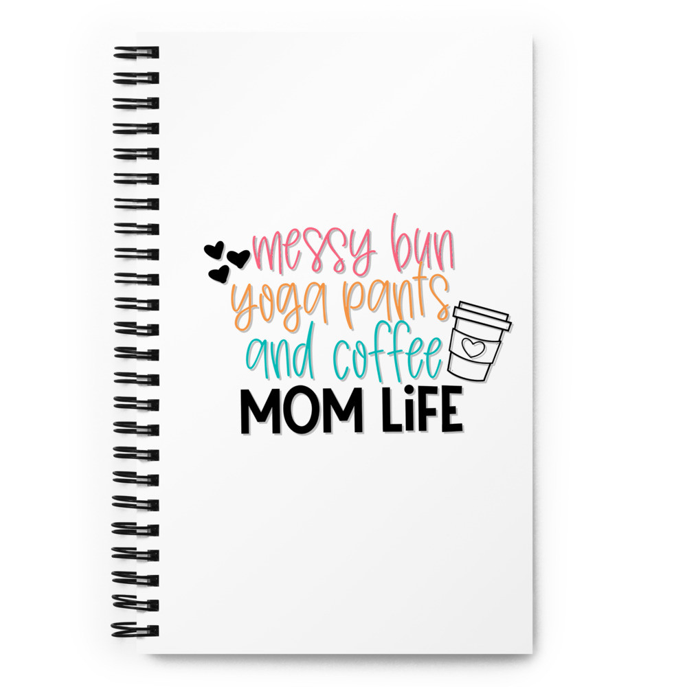 Spiral notebook messy bun yoga pants and coffee