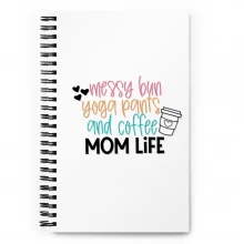 Spiral notebook messy bun yoga pants and coffee